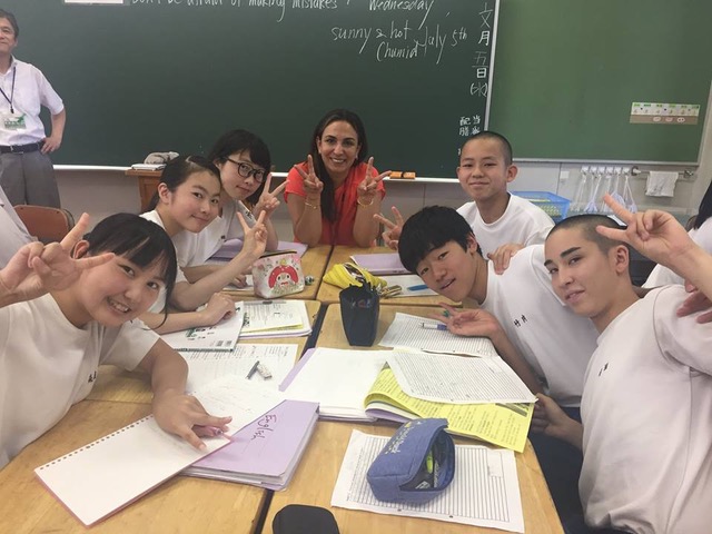 Professor Molina engaging in dialogue with middle school students in Japan.