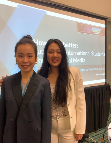 Picture of Viva Ye and Violet Yin in front of their presentation